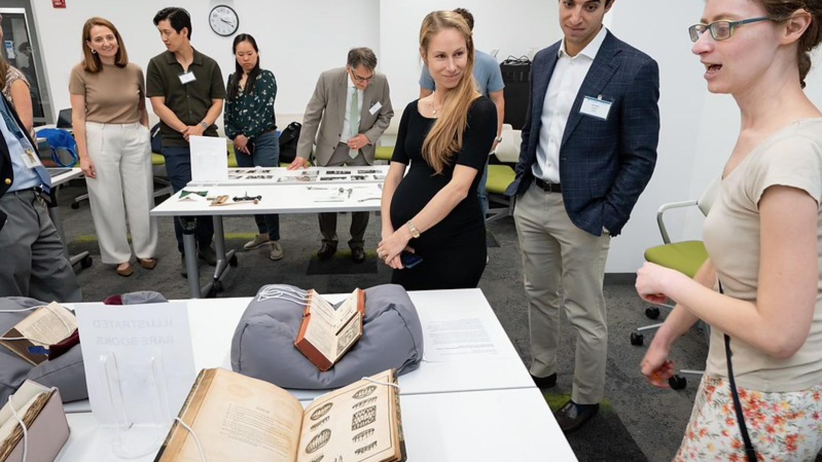 Alumni enjoying archival presentation
