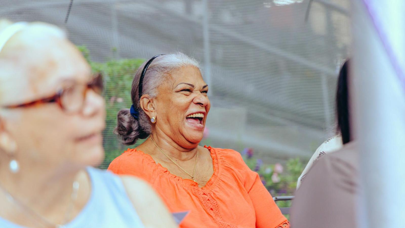Patient laughing at health far.