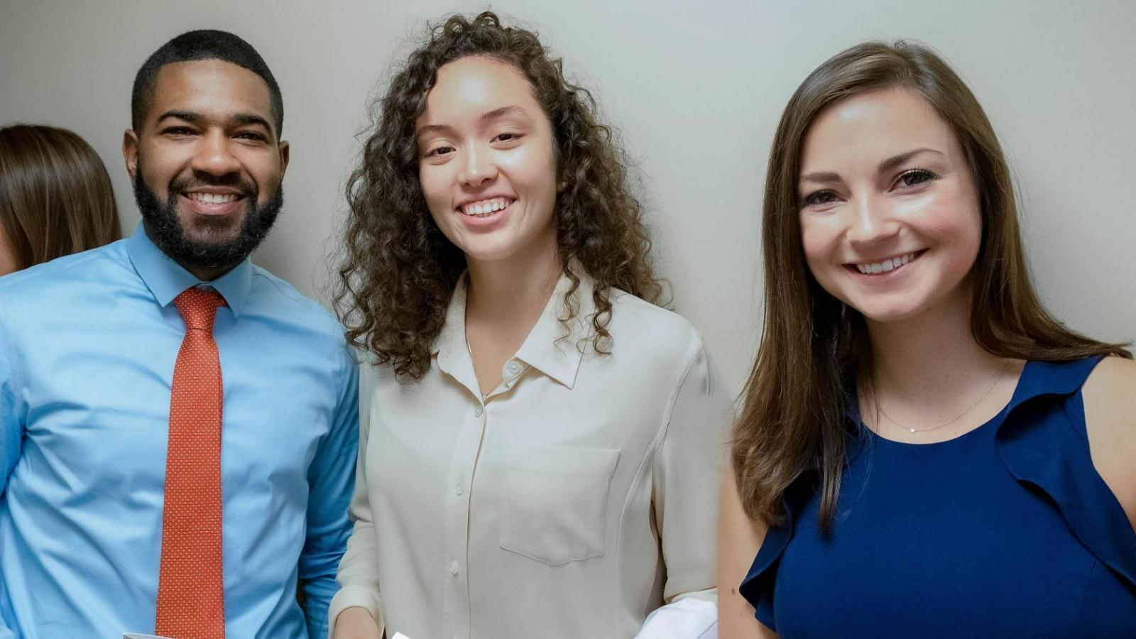 Three students before the ceremony