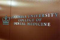 The sign of college of dental medcine with a brown background