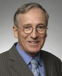 Headshot of Dr. Stohler who is a white man with spectacles. He is smiling at at camera