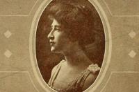 A headshot of a woman who is looking sideways