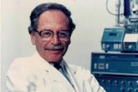 Headshot of Dr.Mandel who is wearing his apron and smiling at the camera