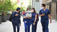 Four Dental students walking and talking together