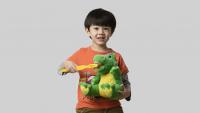 young boy with stuffed animal and oversized toothbrush
