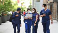 Four Dental students walking and talking together