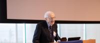 Dr. Norman Khan giving a speech