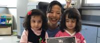 Lee with two pediatric patients